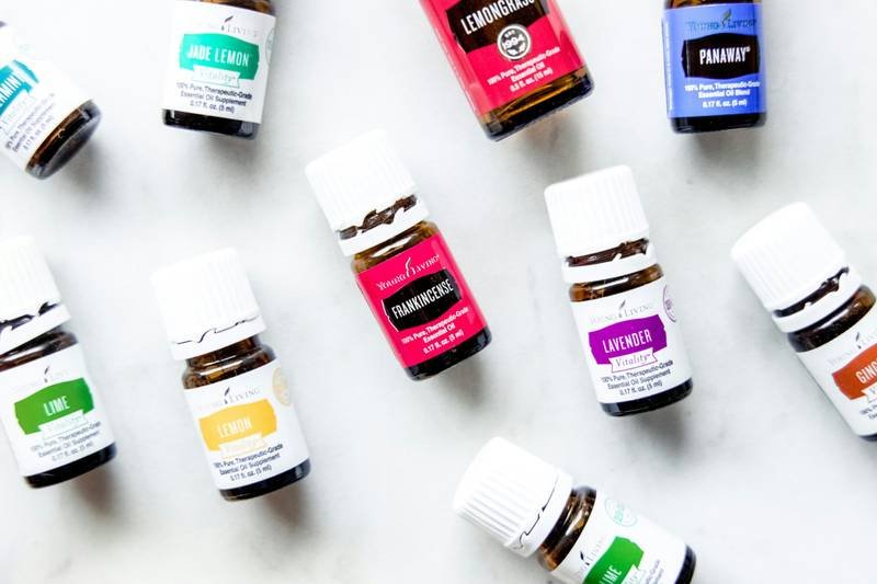 a group of bottles of essential oils on a table